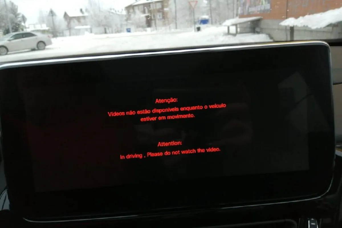 Предупреждение на экране мультимедиа Exeed TXL